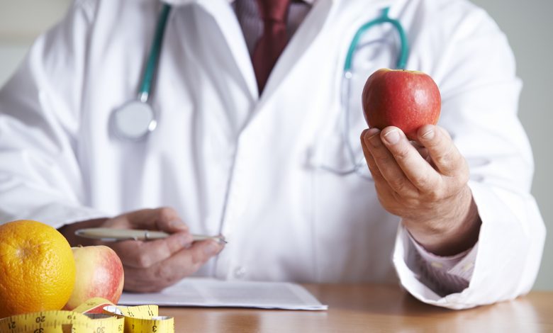 Doctor Giving Advice On Healthy Diet